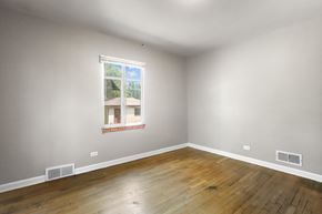 Denver apartment for rent - an empty room with wood floors and a window